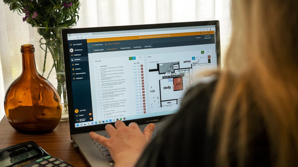 Estimator Tara Hogan works at her desk