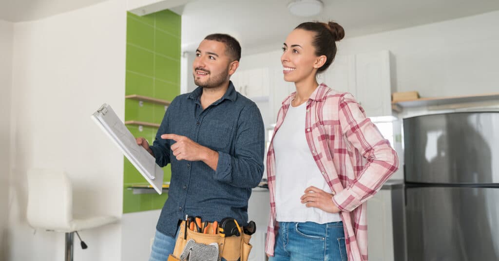 A renovation builder speaks to a client