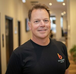 headshot of Chris Rennie, BX Chief Product Officer