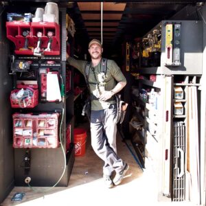 Builder Brian Yambor stands in his workshop